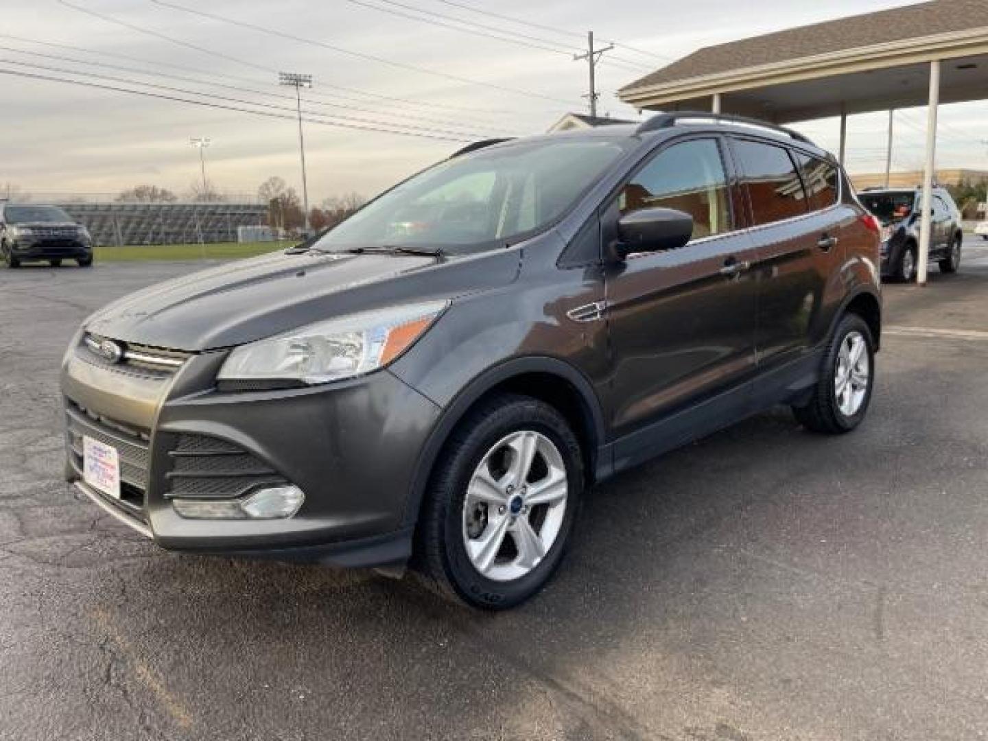 2016 Magnetic Metallic Ford Escape SE 4WD (1FMCU9G99GU) with an 2.0L L4 DOHC 16V engine, 6-Speed Automatic transmission, located at 1230 East Main St, Xenia, OH, 45385, (937) 908-9800, 39.688026, -83.910172 - Photo#1