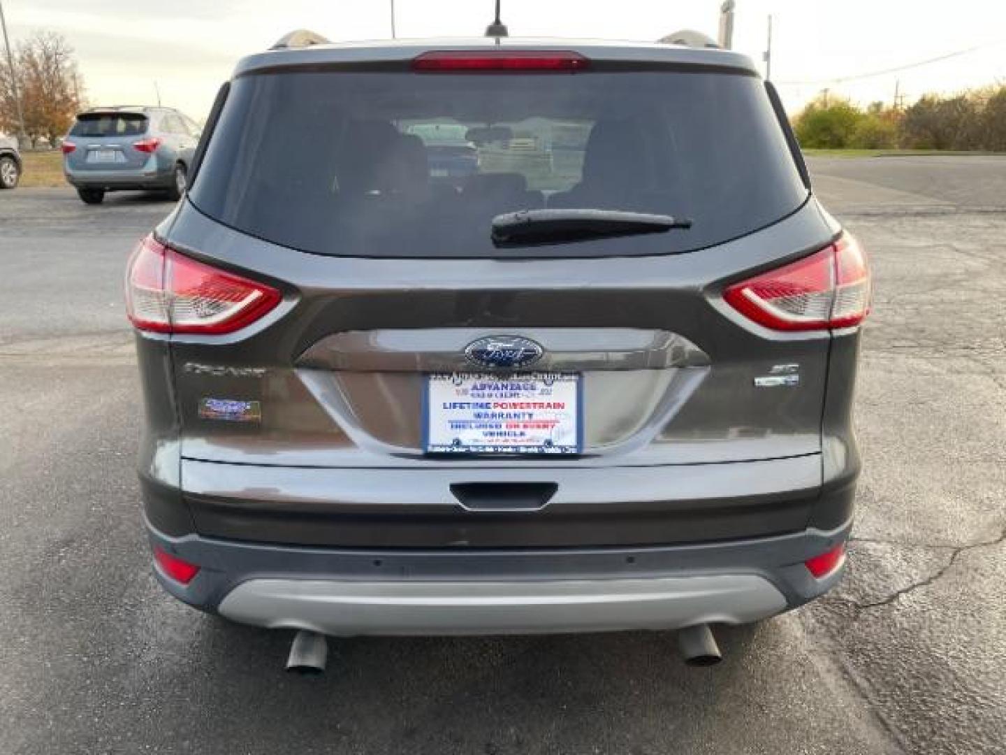 2016 Magnetic Metallic Ford Escape SE 4WD (1FMCU9G99GU) with an 2.0L L4 DOHC 16V engine, 6-Speed Automatic transmission, located at 1230 East Main St, Xenia, OH, 45385, (937) 908-9800, 39.688026, -83.910172 - Photo#4