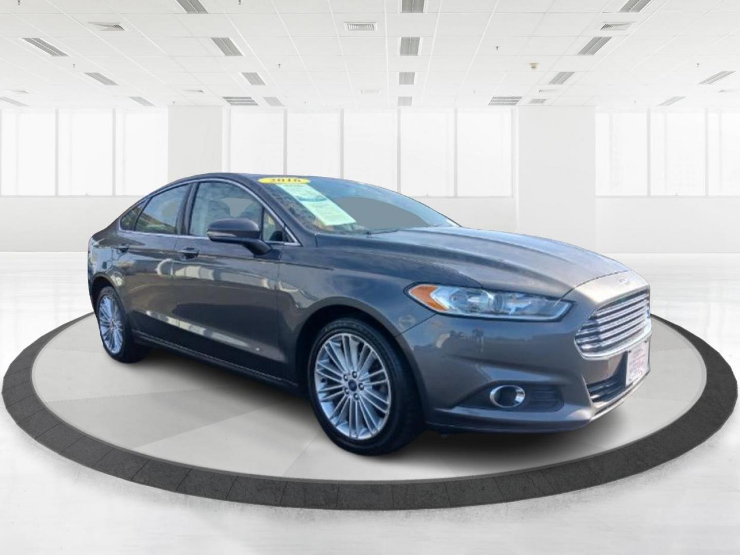 2016 Shadow Black Ford Fusion (3FA6P0T99GR) with an 2.0L L4 DOHC 16V engine, 6-Speed Automatic transmission, located at 1099 N County Rd 25A, Troy, OH, 45373, (937) 908-9800, 40.057079, -84.212883 - Photo#0