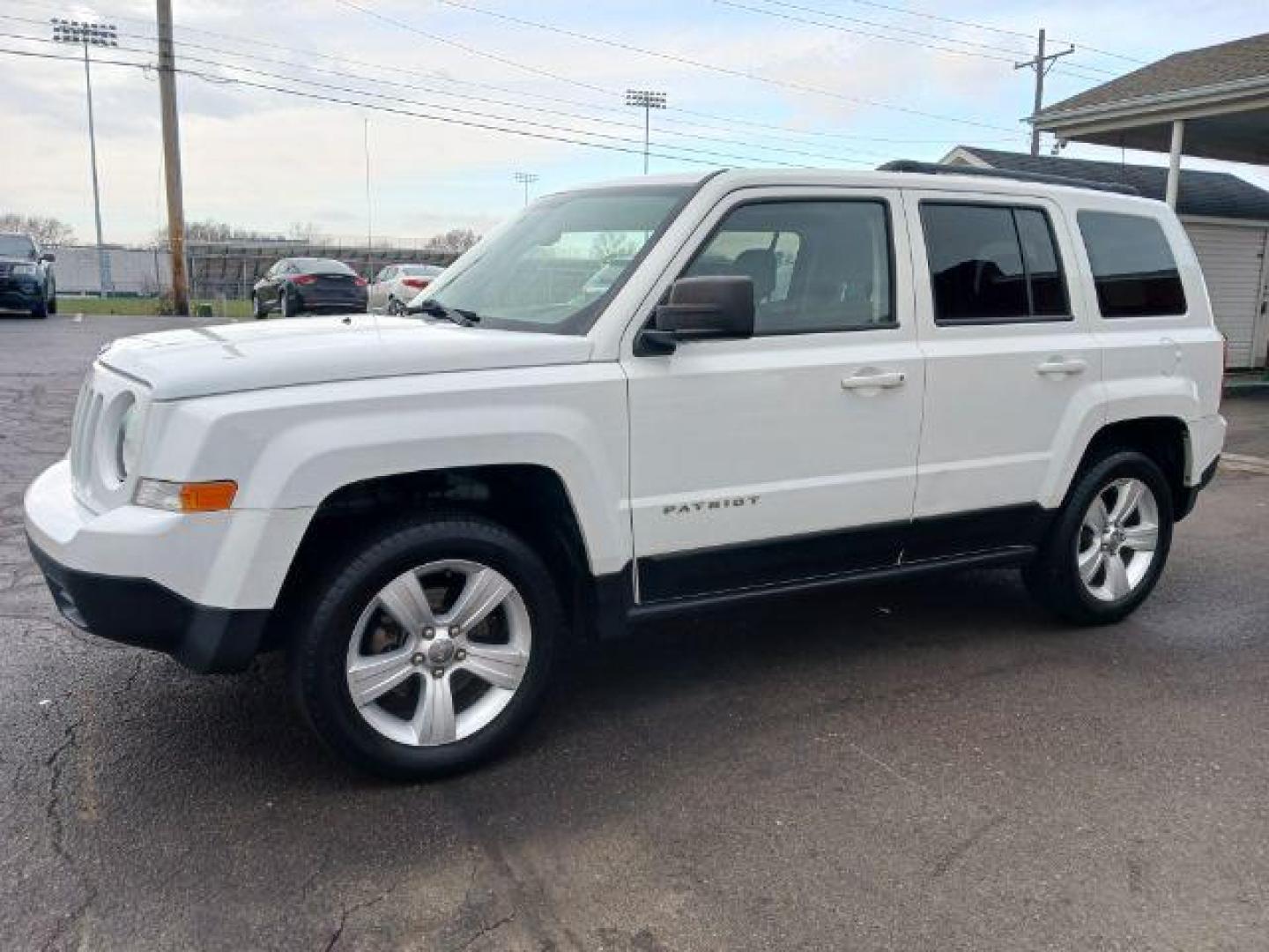 2016 White Jeep Patriot Latitude 4WD (1C4NJRFB7GD) with an 2.4L L4 DOHC 16V engine, located at 1951 S Dayton Lakeview Rd., New Carlisle, OH, 45344, (937) 908-9800, 39.890999, -84.050255 - Photo#2