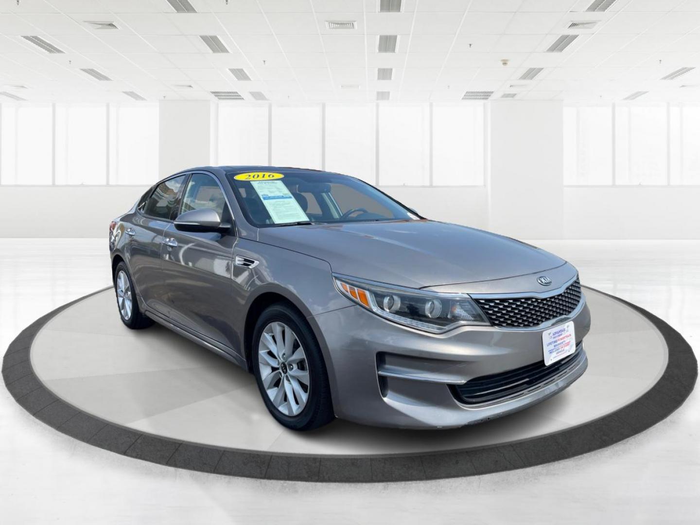 2016 Moss Grey Kia Optima EX (5XXGU4L38GG) with an 2.4L L4 DOHC 16V engine, 6-Speed Automatic transmission, located at 880 E. National Road, Vandalia, OH, 45377, (937) 908-9800, 39.891918, -84.183594 - Photo#0