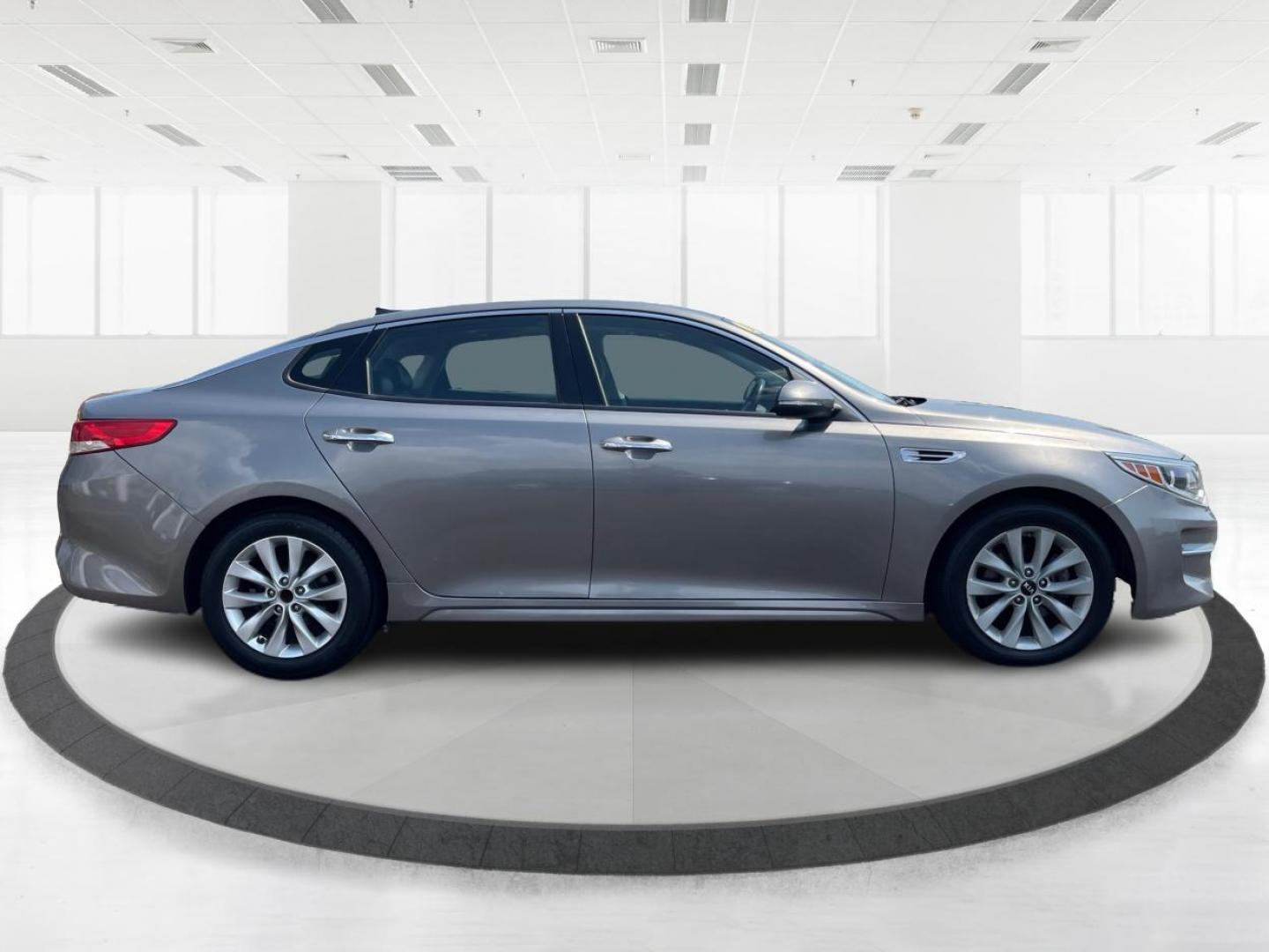 2016 Moss Grey Kia Optima EX (5XXGU4L38GG) with an 2.4L L4 DOHC 16V engine, 6-Speed Automatic transmission, located at 880 E. National Road, Vandalia, OH, 45377, (937) 908-9800, 39.891918, -84.183594 - Photo#1