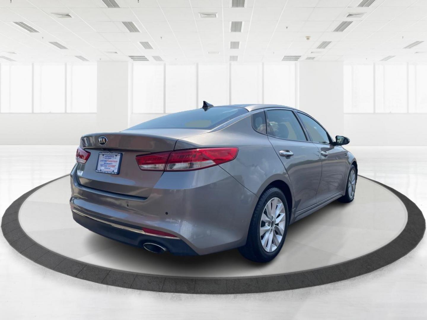 2016 Moss Grey Kia Optima EX (5XXGU4L38GG) with an 2.4L L4 DOHC 16V engine, 6-Speed Automatic transmission, located at 880 E. National Road, Vandalia, OH, 45377, (937) 908-9800, 39.891918, -84.183594 - Photo#2