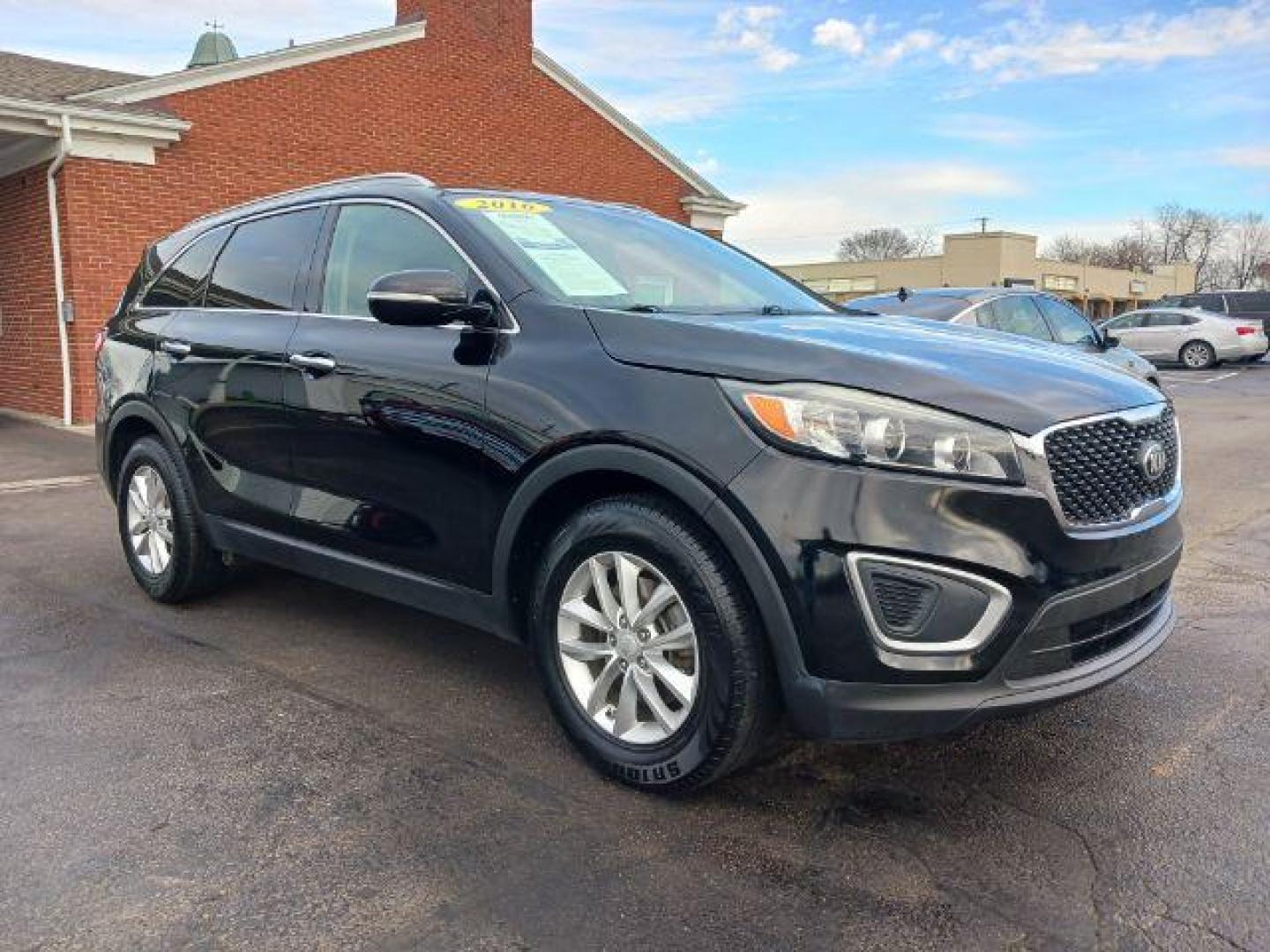 2016 Ebony Black Kia Sorento LX 2WD (5XYPG4A34GG) with an 2.4L L4 DOHC 16V engine, 6-Speed Automatic transmission, located at 880 E. National Road, Vandalia, OH, 45377, (937) 908-9800, 39.891918, -84.183594 - Photo#0