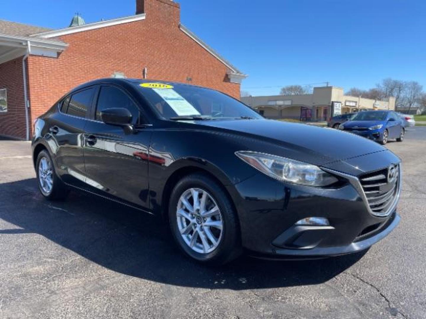 2016 Jet Black Mica Mazda MAZDA3 i Sport AT 4-Door (JM1BM1U73G1) with an 2.0L L4 DOHC 16V engine, 6-Speed Automatic transmission, located at 4508 South Dixie Dr, Moraine, OH, 45439, (937) 908-9800, 39.689976, -84.218452 - Photo#0