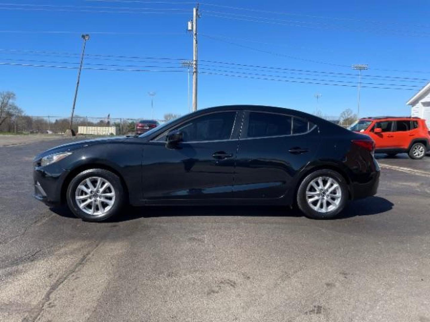 2016 Jet Black Mica Mazda MAZDA3 i Sport AT 4-Door (JM1BM1U73G1) with an 2.0L L4 DOHC 16V engine, 6-Speed Automatic transmission, located at 4508 South Dixie Dr, Moraine, OH, 45439, (937) 908-9800, 39.689976, -84.218452 - Photo#2