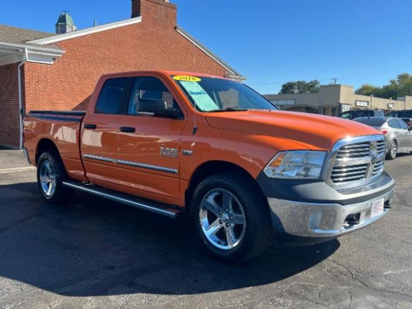 2016 Low Vol Omaha Orange RAM 1500 SLT Quad Cab 4WD (1C6RR7GT3GS) with an 5.7L V8 OHV 16V engine, 8-Speed Automatic transmission, located at 1099 N County Rd 25A, Troy, OH, 45373, (937) 908-9800, 40.057079, -84.212883 - Photo#0