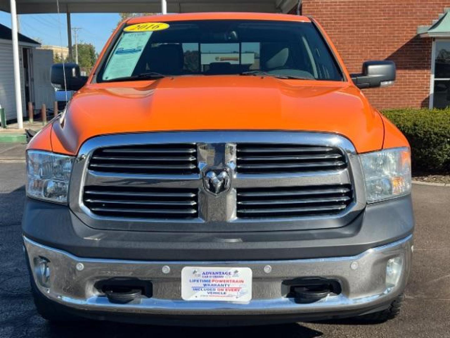 2016 Low Vol Omaha Orange RAM 1500 SLT Quad Cab 4WD (1C6RR7GT3GS) with an 5.7L V8 OHV 16V engine, 8-Speed Automatic transmission, located at 1099 N County Rd 25A, Troy, OH, 45373, (937) 908-9800, 40.057079, -84.212883 - Photo#1