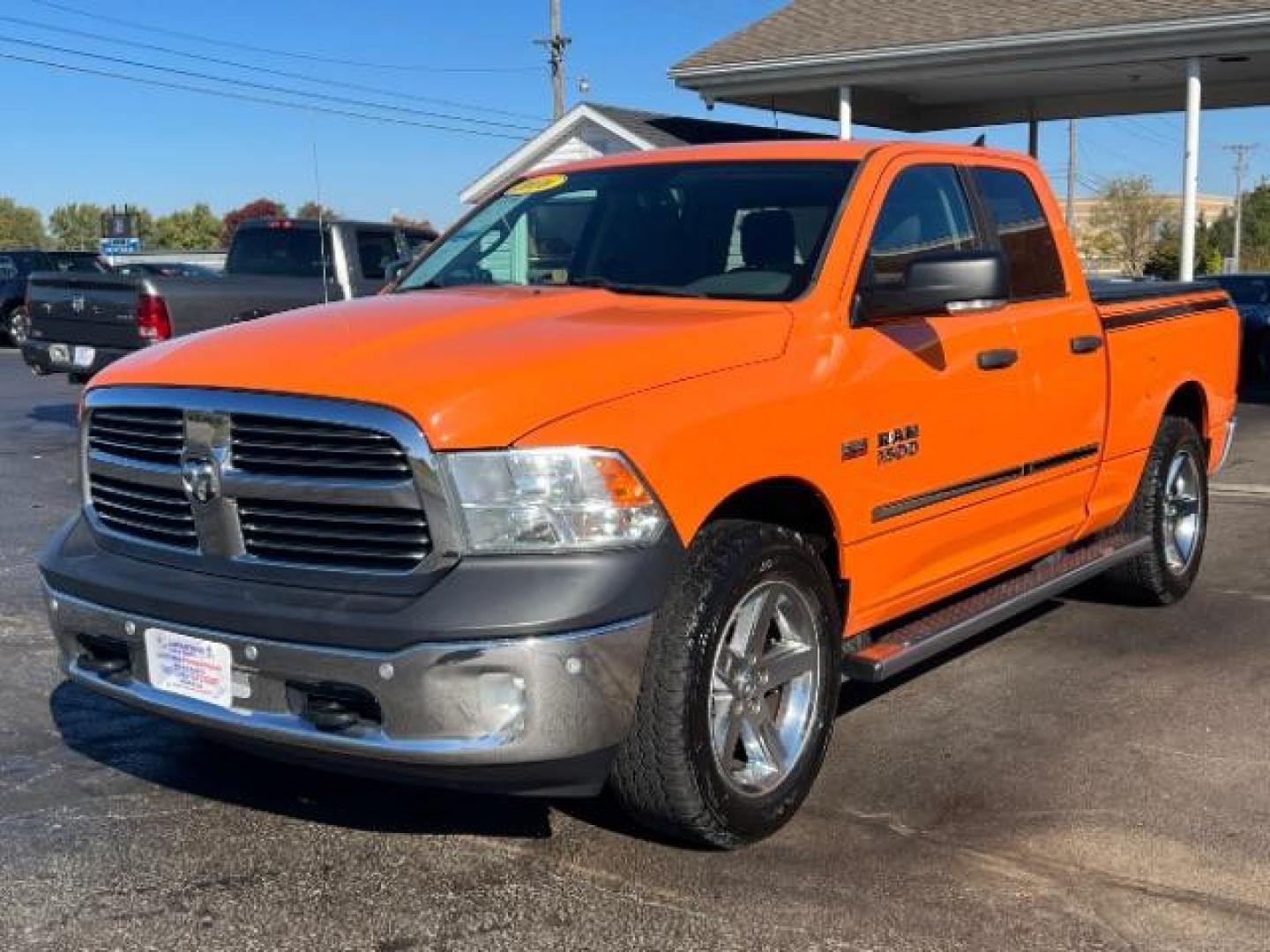 2016 Low Vol Omaha Orange RAM 1500 SLT Quad Cab 4WD (1C6RR7GT3GS) with an 5.7L V8 OHV 16V engine, 8-Speed Automatic transmission, located at 1099 N County Rd 25A, Troy, OH, 45373, (937) 908-9800, 40.057079, -84.212883 - Photo#2