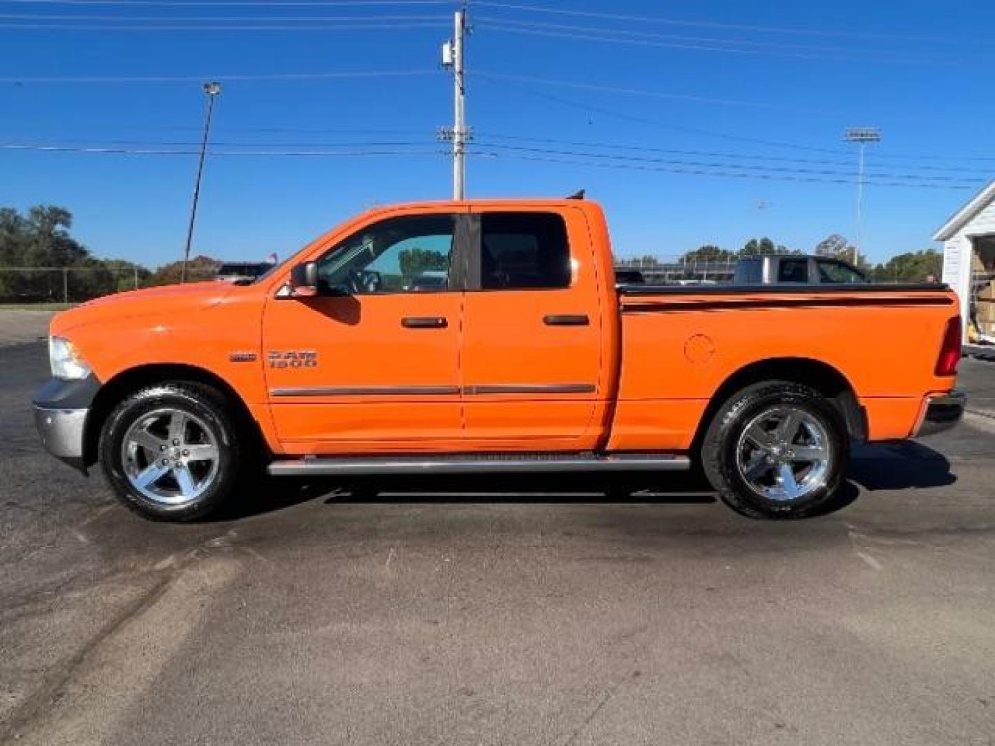 2016 Low Vol Omaha Orange RAM 1500 SLT Quad Cab 4WD (1C6RR7GT3GS) with an 5.7L V8 OHV 16V engine, 8-Speed Automatic transmission, located at 1099 N County Rd 25A, Troy, OH, 45373, (937) 908-9800, 40.057079, -84.212883 - Photo#3