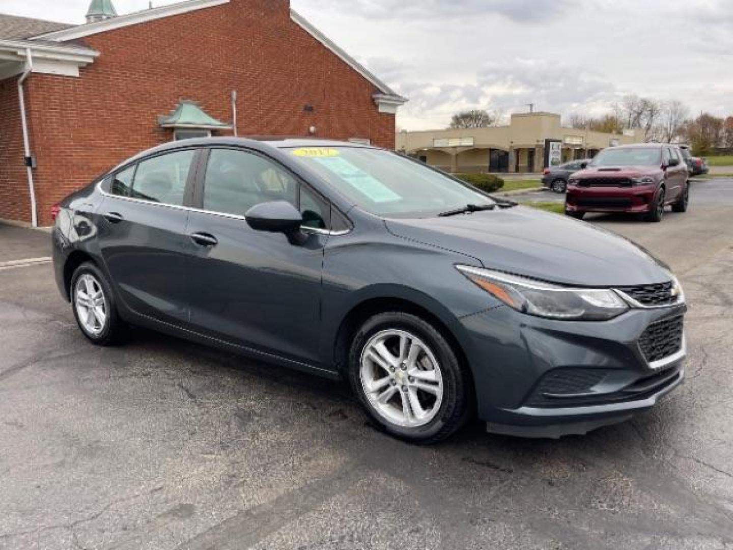 2017 Tungsten Metallic Chevrolet Cruze LT Auto (1G1BE5SM0H7) with an 1.4L L4 DOHC 16V TURBO engine, 6-Speed Automatic transmission, located at 1951 S Dayton Lakeview Rd., New Carlisle, OH, 45344, (937) 908-9800, 39.890999, -84.050255 - Photo#0