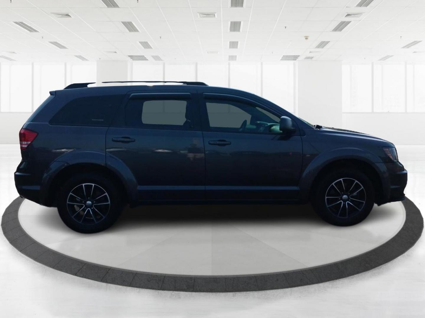 2017 Granite Metallic Clear Coat Dodge Journey SE (3C4PDCAB5HT) with an 2.4L L4 DOHC 16V engine, 4-Speed Automatic transmission, located at 1184 Kauffman Ave, Fairborn, OH, 45324, (937) 908-9800, 39.807072, -84.030914 - Photo#0