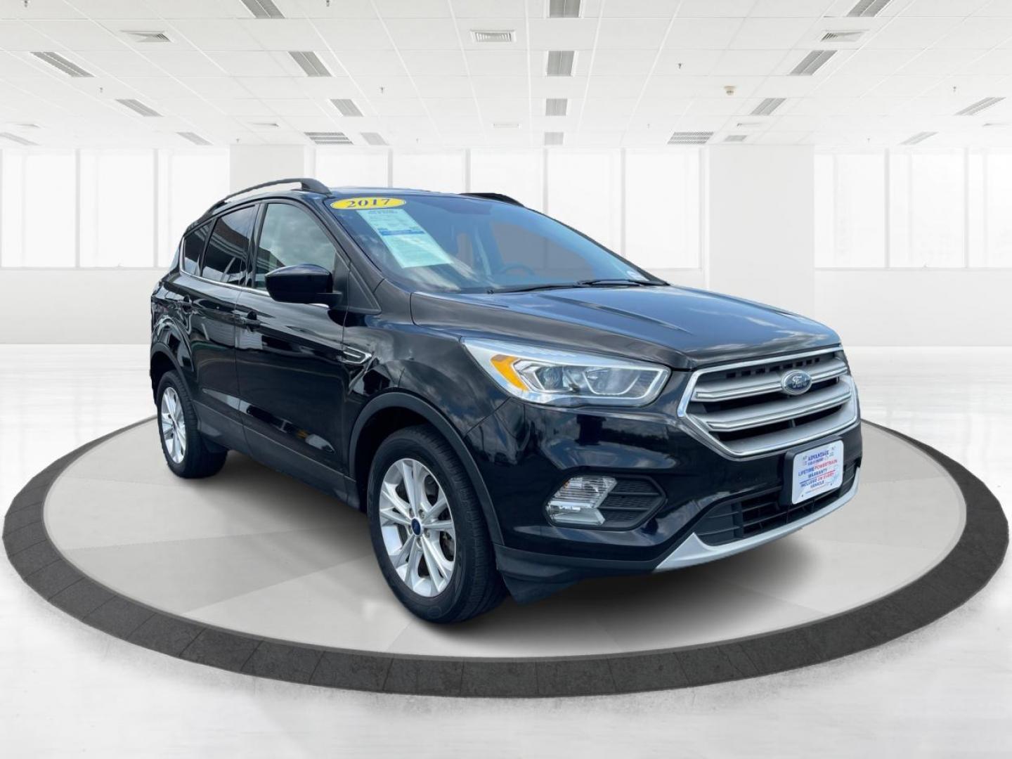 2017 Shadow Black Ford Escape SE 4WD (1FMCU9GD9HU) with an 1.5L L4 DOHC 16V engine, 6-Speed Automatic transmission, located at 1184 Kauffman Ave, Fairborn, OH, 45324, (937) 908-9800, 39.807072, -84.030914 - Photo#0