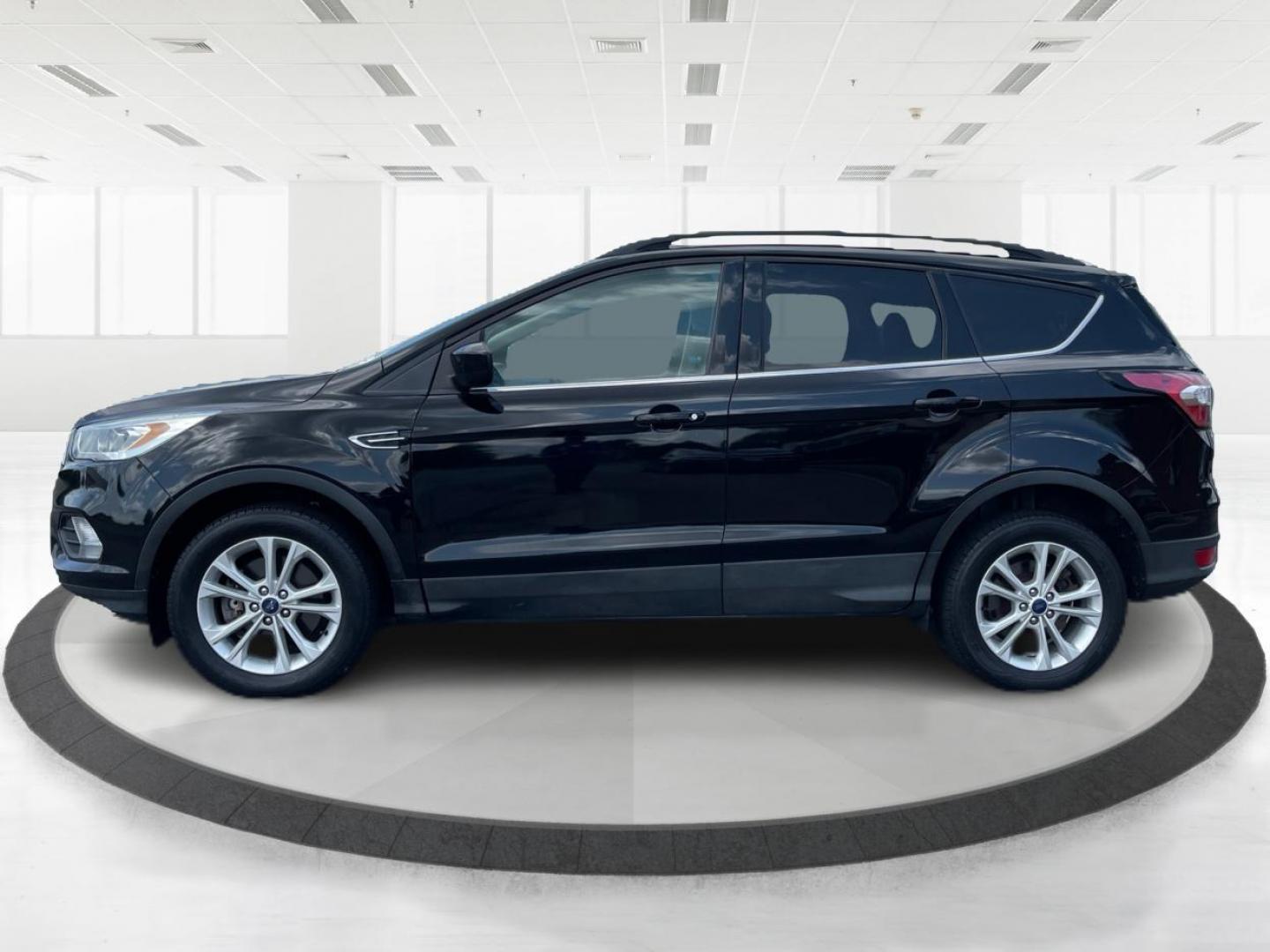 2017 Shadow Black Ford Escape SE 4WD (1FMCU9GD9HU) with an 1.5L L4 DOHC 16V engine, 6-Speed Automatic transmission, located at 1184 Kauffman Ave, Fairborn, OH, 45324, (937) 908-9800, 39.807072, -84.030914 - Photo#5