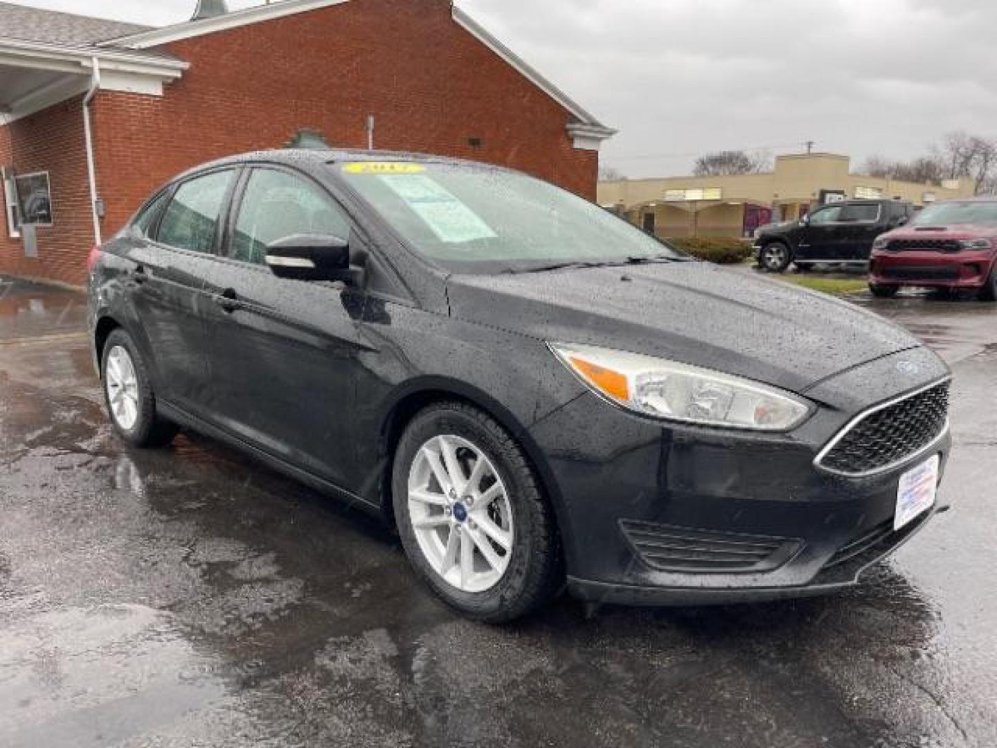 2017 Shadow Black Ford Focus SE Sedan (1FADP3F23HL) with an 2.0L L4 DOHC 16V engine, located at 1099 N County Rd 25A, Troy, OH, 45373, (937) 908-9800, 40.057079, -84.212883 - Photo#0