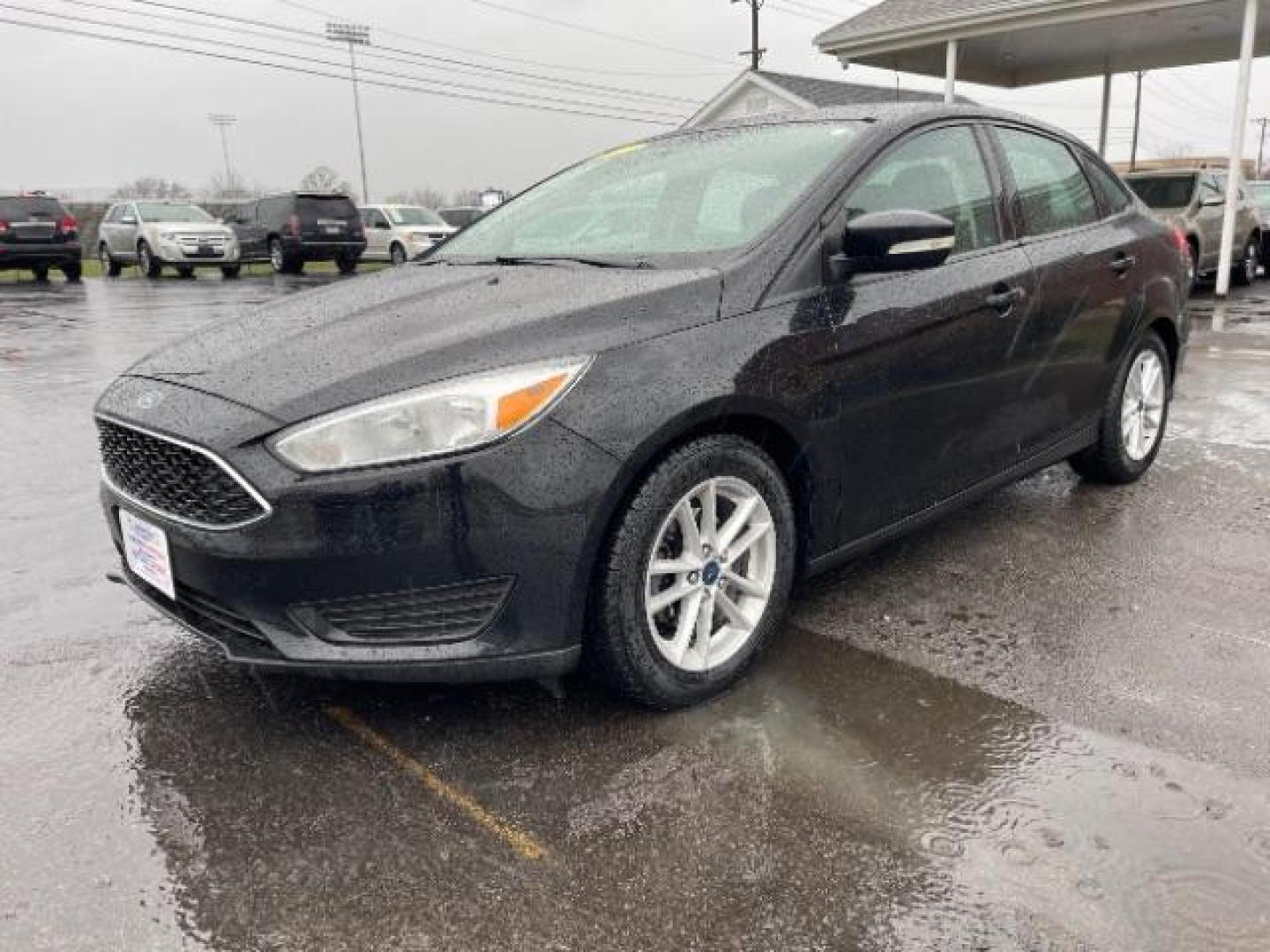 2017 Shadow Black Ford Focus SE Sedan (1FADP3F23HL) with an 2.0L L4 DOHC 16V engine, located at 1099 N County Rd 25A, Troy, OH, 45373, (937) 908-9800, 40.057079, -84.212883 - Photo#1