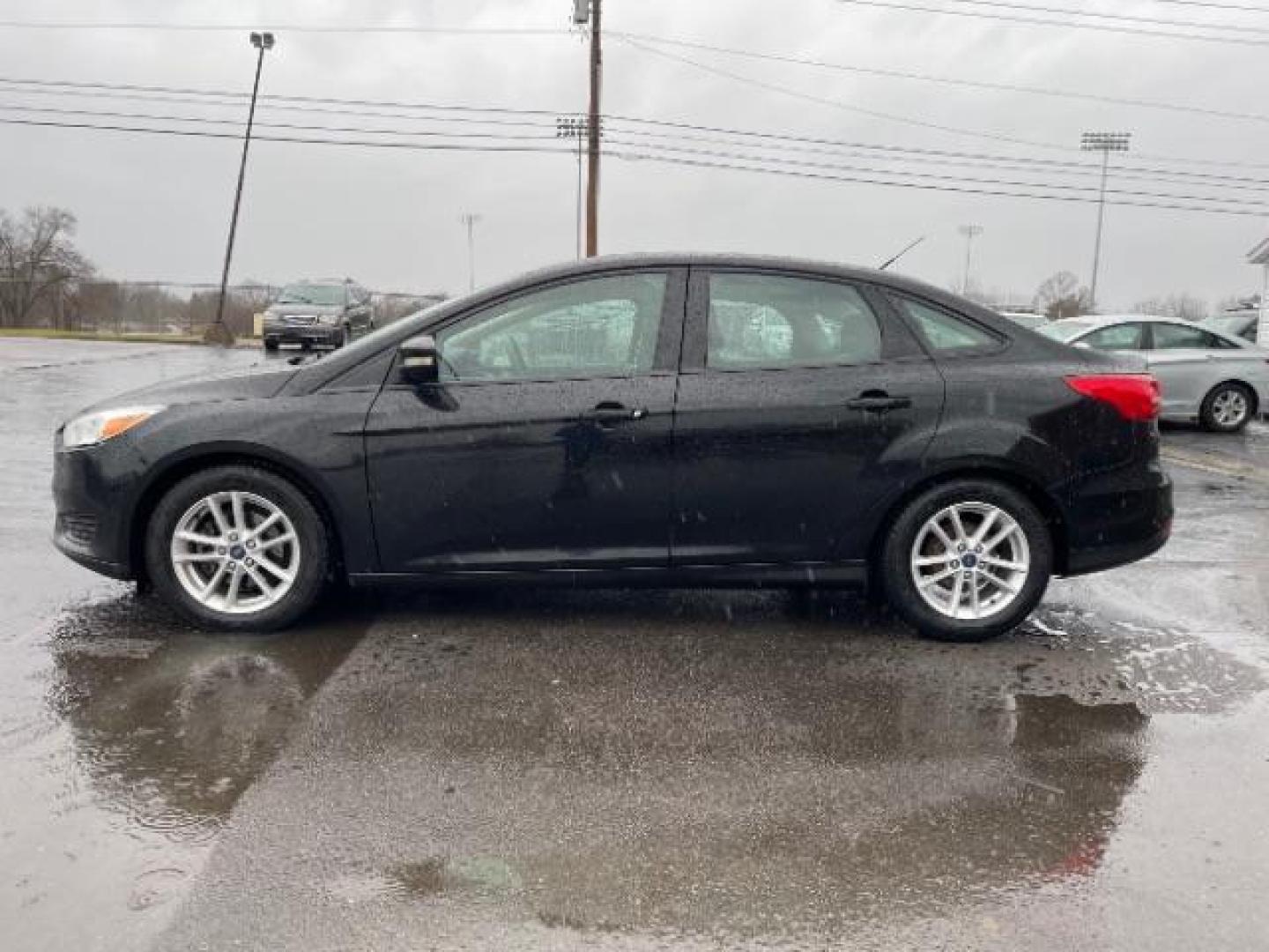 2017 Shadow Black Ford Focus SE Sedan (1FADP3F23HL) with an 2.0L L4 DOHC 16V engine, located at 1099 N County Rd 25A, Troy, OH, 45373, (937) 908-9800, 40.057079, -84.212883 - Photo#4