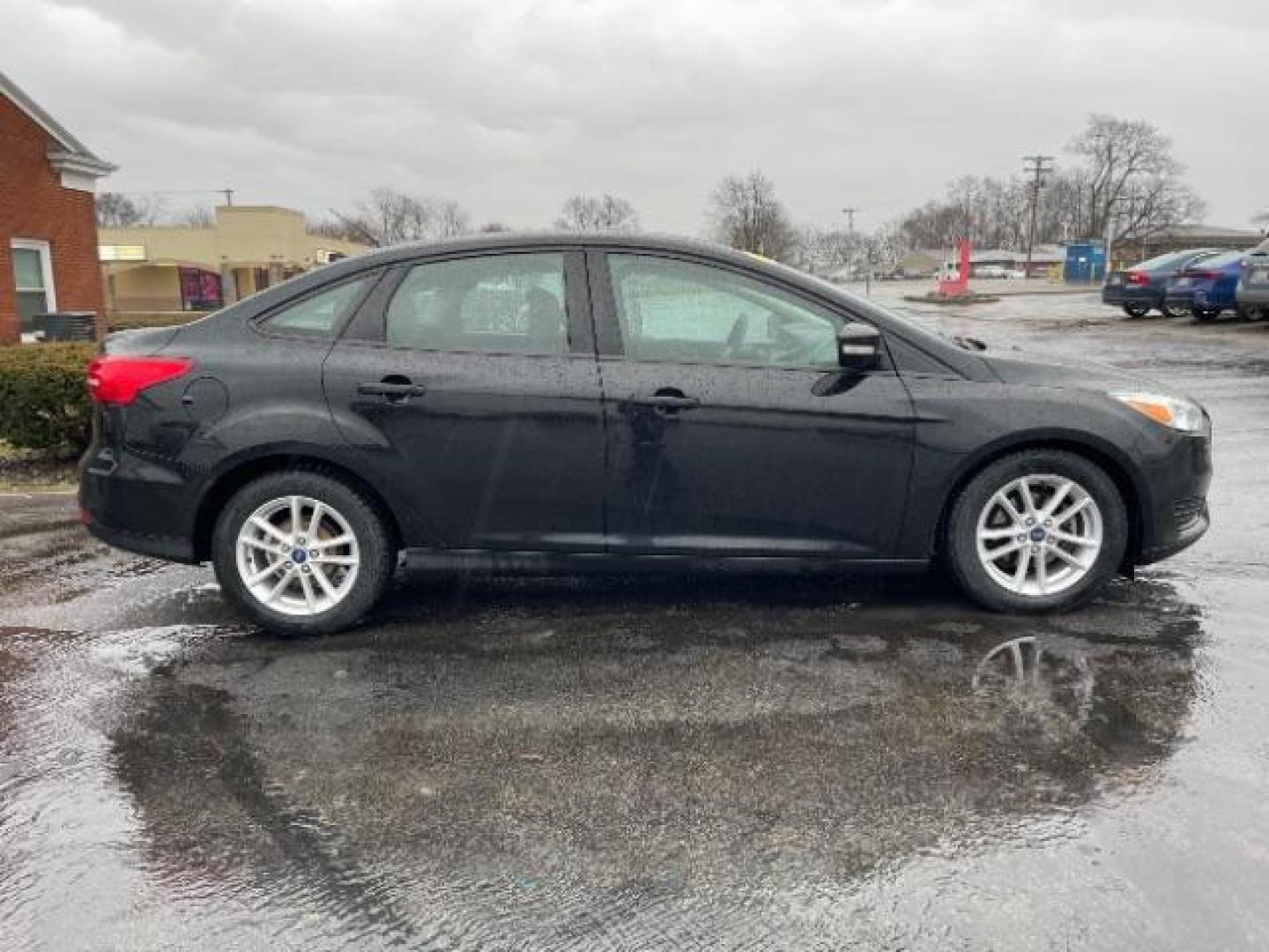 2017 Shadow Black Ford Focus SE Sedan (1FADP3F23HL) with an 2.0L L4 DOHC 16V engine, located at 1099 N County Rd 25A, Troy, OH, 45373, (937) 908-9800, 40.057079, -84.212883 - Photo#5