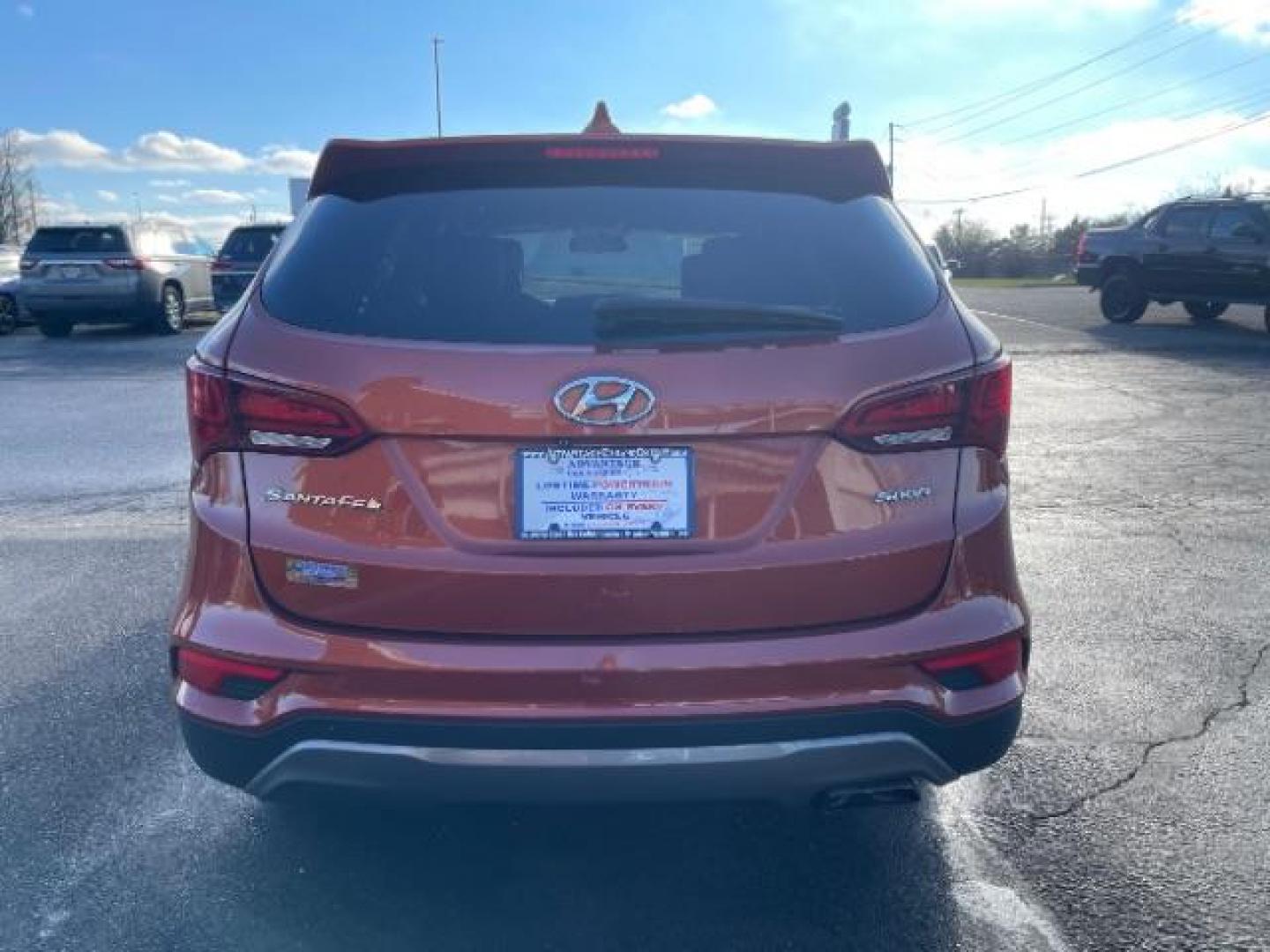 2017 Canyon Copper Hyundai Santa Fe Sport 2.4 FWD (5XYZT3LB8HG) with an 2.4L L4 DOHC 16V engine, 6-Speed Automatic transmission, located at 1230 East Main St, Xenia, OH, 45385, (937) 908-9800, 39.688026, -83.910172 - Photo#4