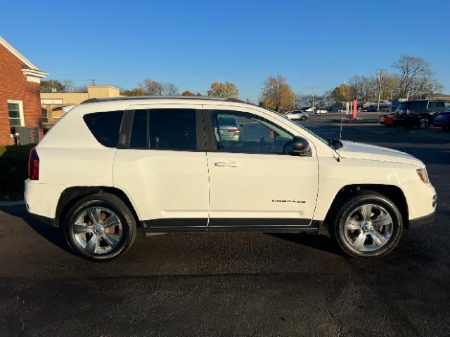 2017 White Knuckle Clear Coat Jeep Compass Sport FWD (1C4NJCBA3HD) with an 2.0L L4 DOHC 16V engine, located at 4508 South Dixie Dr, Moraine, OH, 45439, (937) 908-9800, 39.689976, -84.218452 - Photo#5