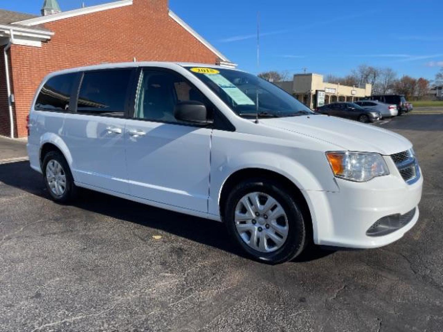 2018 White Knuckle Clear Coat Dodge Grand Caravan SE (2C4RDGBG0JR) with an 3.6L V6 DOHC 24V engine, 6-Speed Automatic transmission, located at 880 E. National Road, Vandalia, OH, 45377, (937) 908-9800, 39.891918, -84.183594 - Photo#0