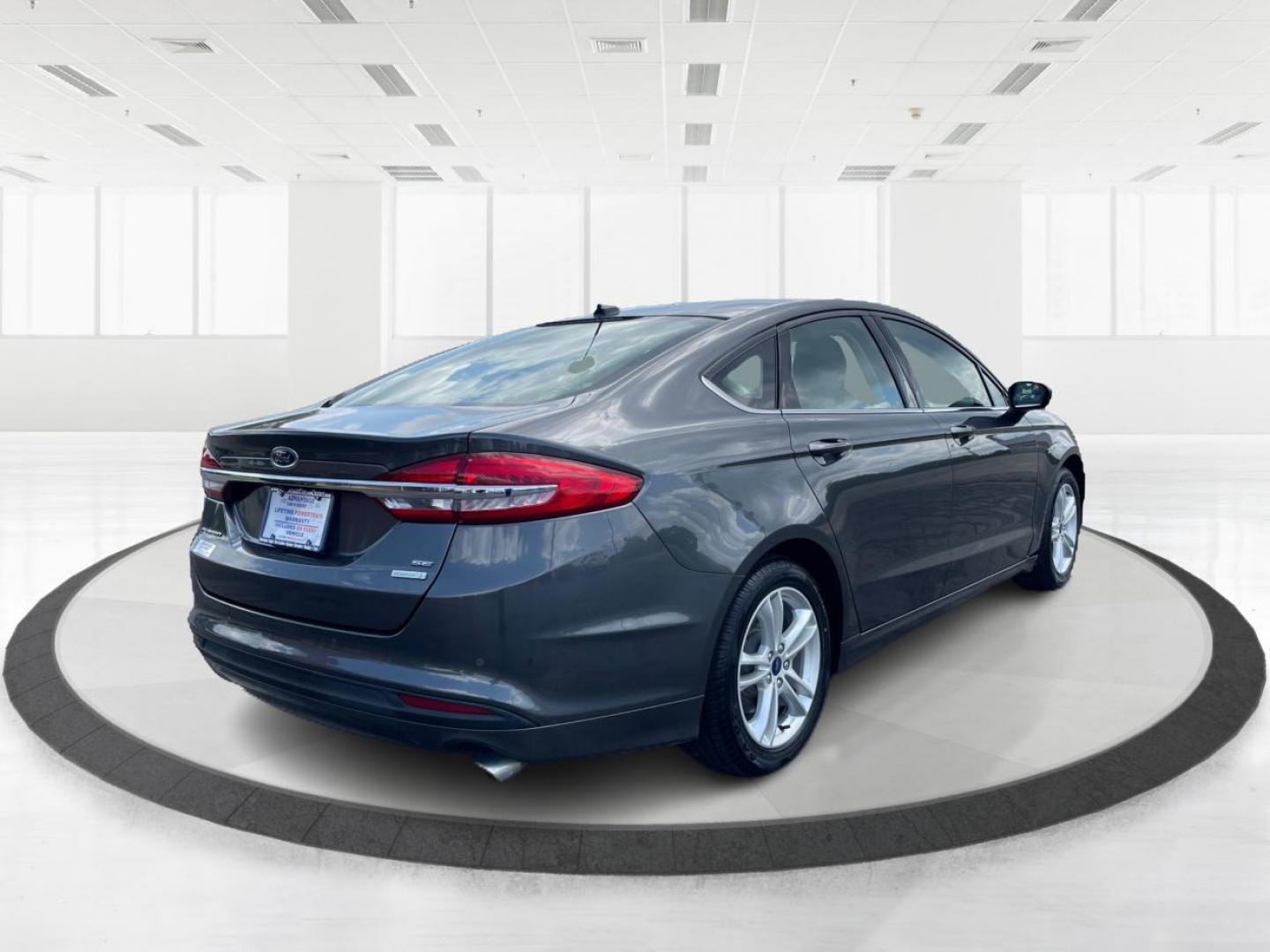 2018 Magnetic Metallic Ford Fusion SE (3FA6P0HD2JR) with an 1.5L L4 DOHC 16V engine, 6-Speed Automatic transmission, located at 1099 N County Rd 25A, Troy, OH, 45373, (937) 908-9800, 40.057079, -84.212883 - Photo#2