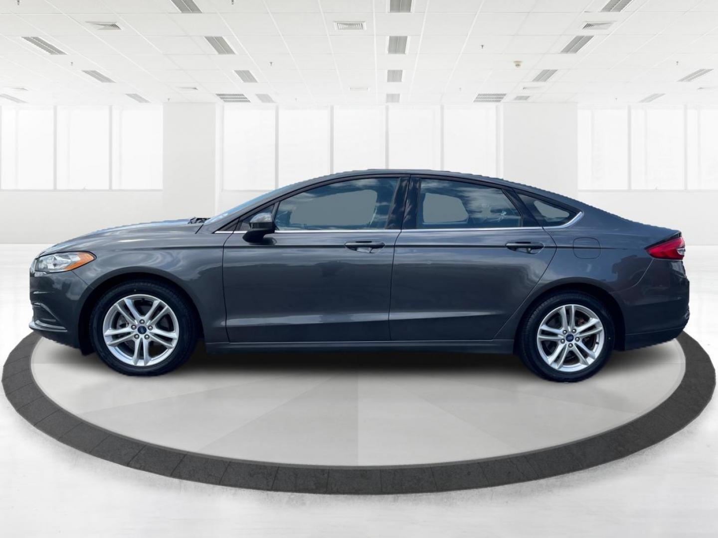 2018 Magnetic Metallic Ford Fusion SE (3FA6P0HD2JR) with an 1.5L L4 DOHC 16V engine, 6-Speed Automatic transmission, located at 1099 N County Rd 25A, Troy, OH, 45373, (937) 908-9800, 40.057079, -84.212883 - Photo#5