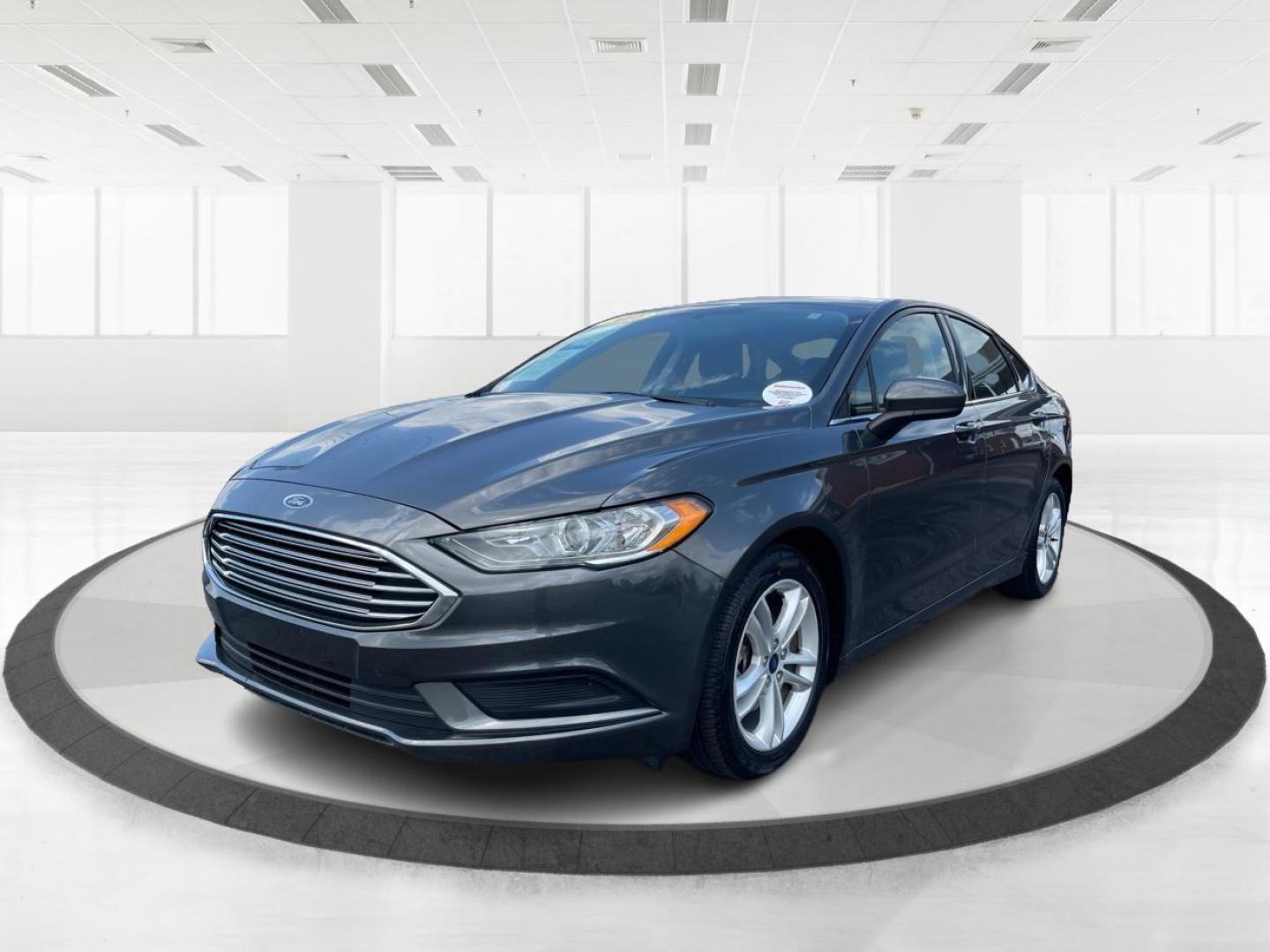 2018 Magnetic Metallic Ford Fusion SE (3FA6P0HD2JR) with an 1.5L L4 DOHC 16V engine, 6-Speed Automatic transmission, located at 1099 N County Rd 25A, Troy, OH, 45373, (937) 908-9800, 40.057079, -84.212883 - Photo#7