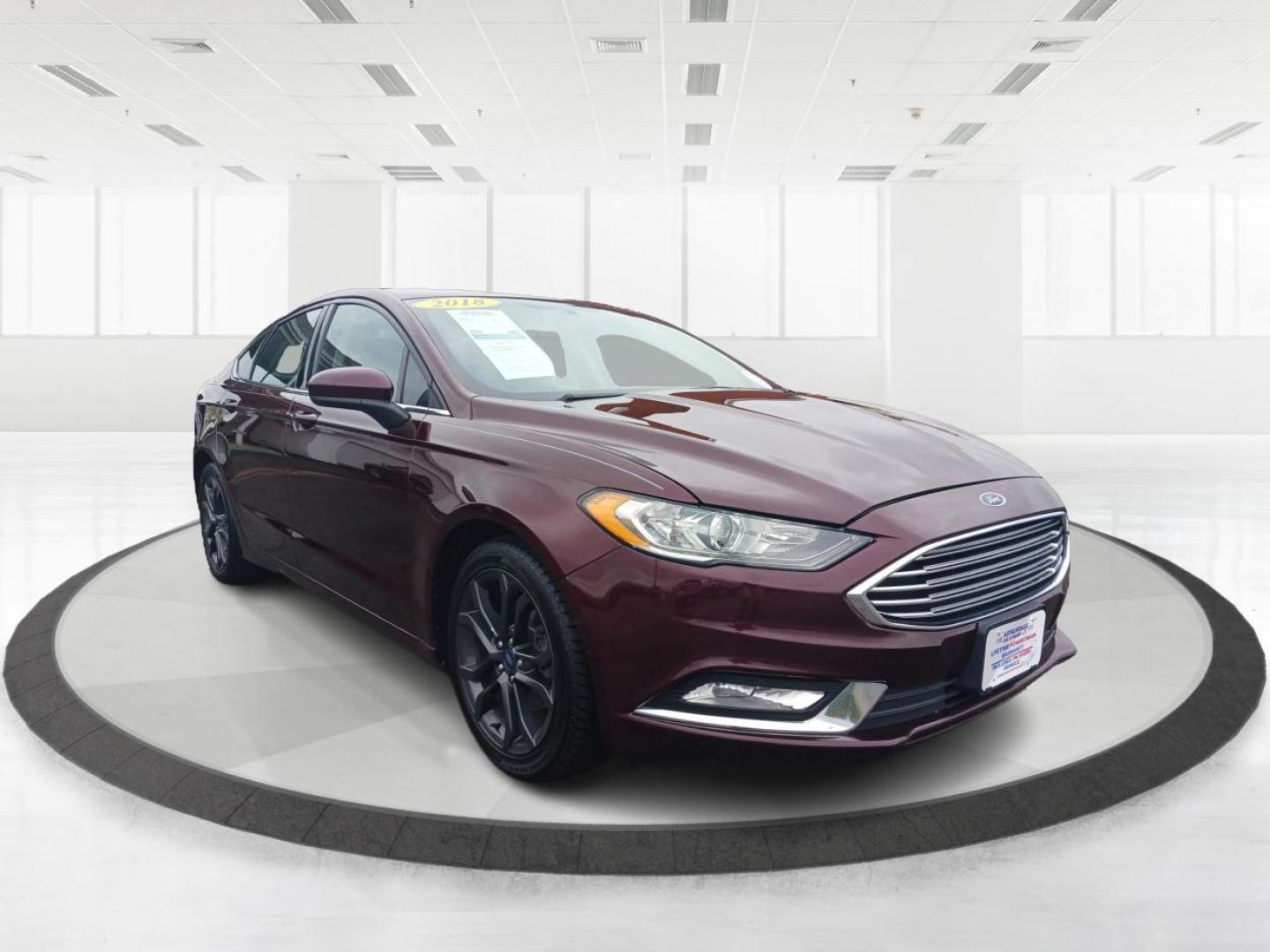 2018 Burgundy Velvet Metallic Tinted Clearcoat Ford Fusion SE (3FA6P0HD1JR) with an 1.5L L4 DOHC 16V engine, 6-Speed Automatic transmission, located at 1099 N County Rd 25A, Troy, OH, 45373, (937) 908-9800, 40.057079, -84.212883 - Photo#0