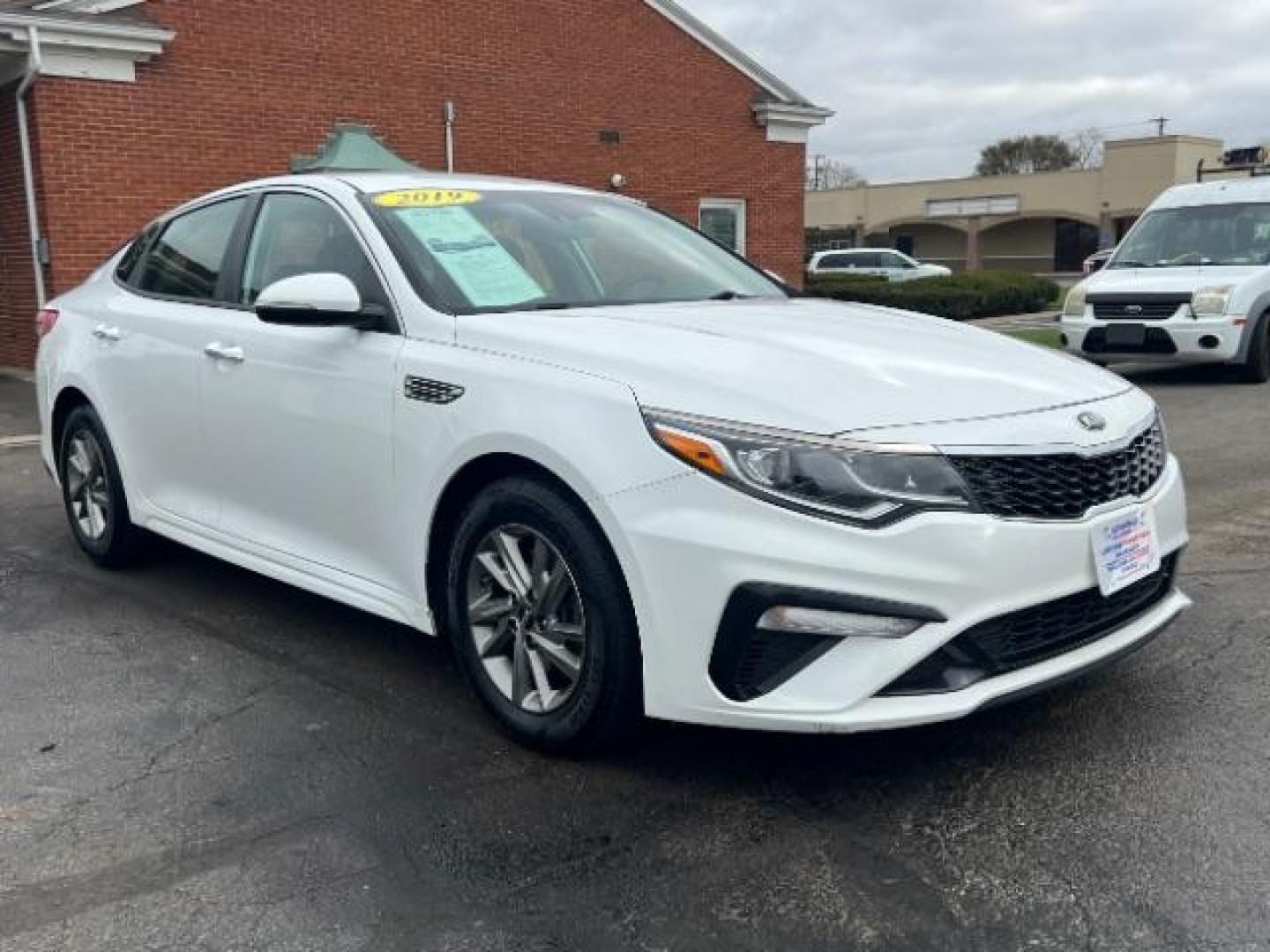 2019 Snow White Pearl Kia Optima LX (5XXGT4L30KG) with an 2.4L L4 DOHC 16V engine, 6-Speed Automatic transmission, located at 880 E. National Road, Vandalia, OH, 45377, (937) 908-9800, 39.891918, -84.183594 - Photo#0