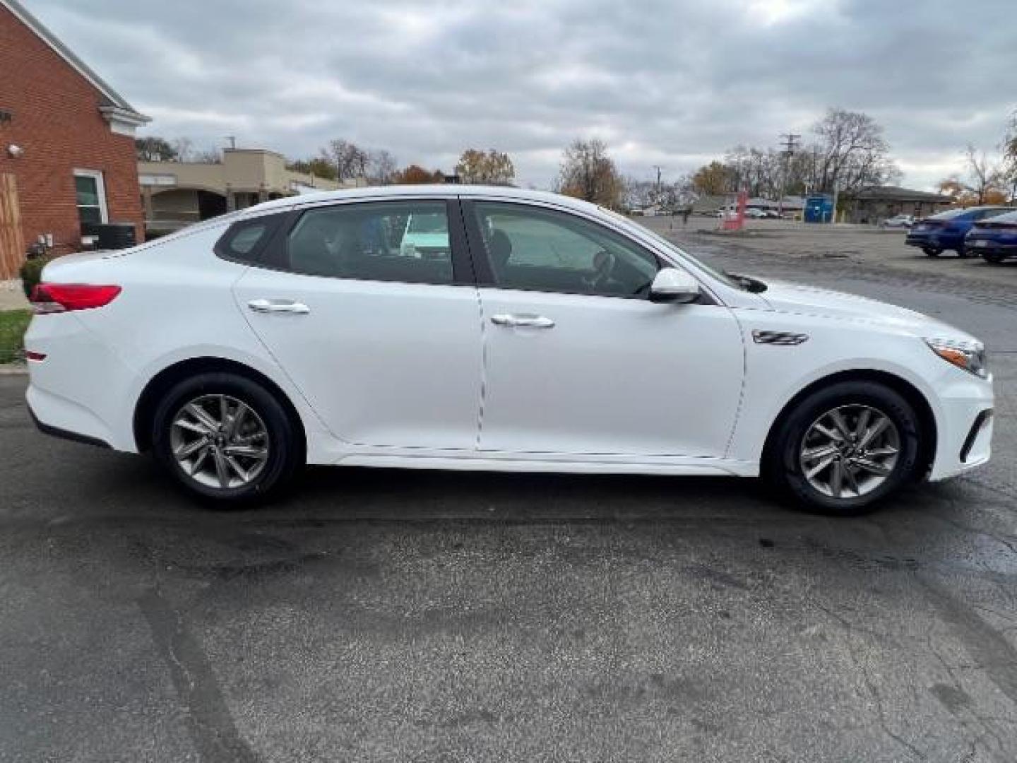 2019 Snow White Pearl Kia Optima LX (5XXGT4L30KG) with an 2.4L L4 DOHC 16V engine, 6-Speed Automatic transmission, located at 880 E. National Road, Vandalia, OH, 45377, (937) 908-9800, 39.891918, -84.183594 - Photo#5