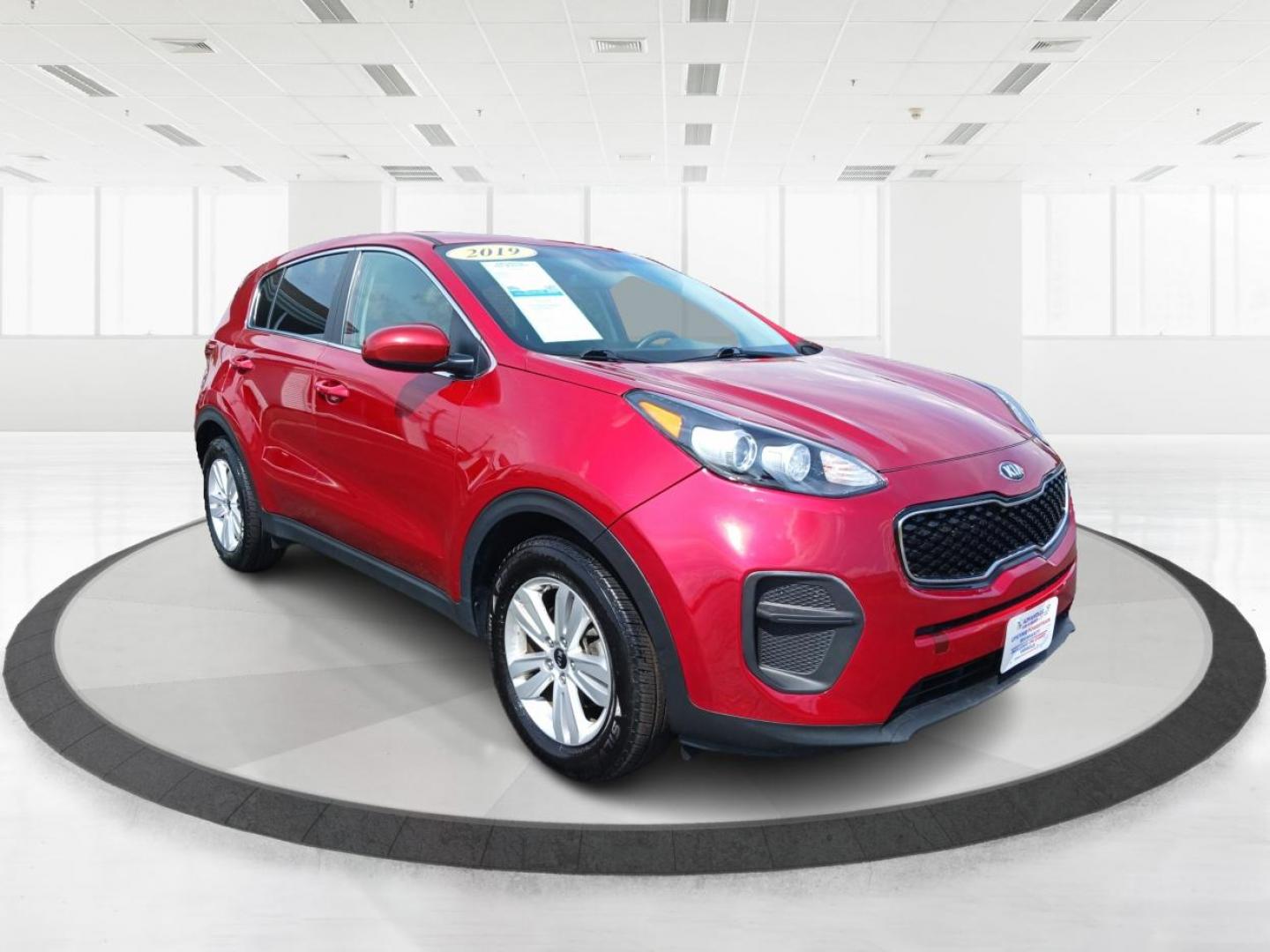 2019 Hyper Red Kia Sportage LX FWD (KNDPM3AC9K7) with an 2.4L V6 DOHC 24V engine, 6-Speed Automatic transmission, located at 1099 N County Rd 25A, Troy, OH, 45373, (937) 908-9800, 40.057079, -84.212883 - Photo#0