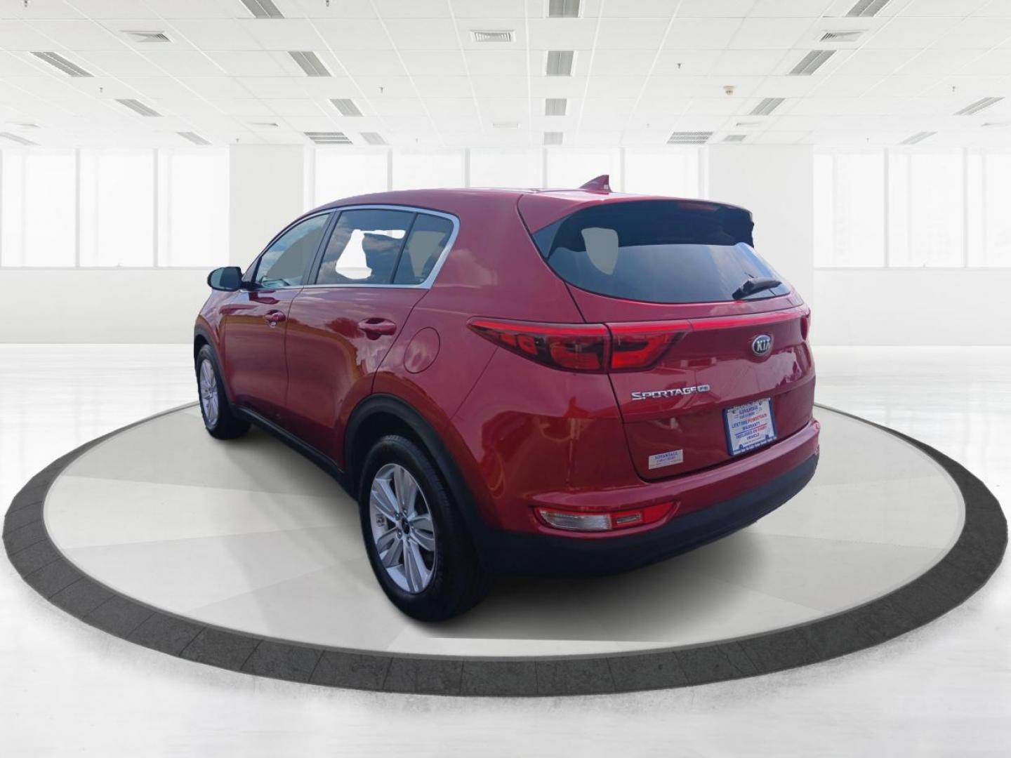 2019 Hyper Red Kia Sportage LX FWD (KNDPM3AC9K7) with an 2.4L V6 DOHC 24V engine, 6-Speed Automatic transmission, located at 1099 N County Rd 25A, Troy, OH, 45373, (937) 908-9800, 40.057079, -84.212883 - Photo#4